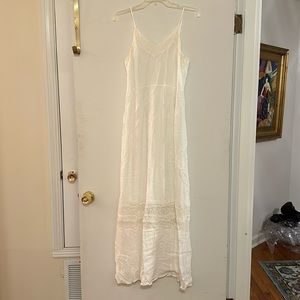 White maxi dress. Has lace insets along the top and bottom. In good condition.